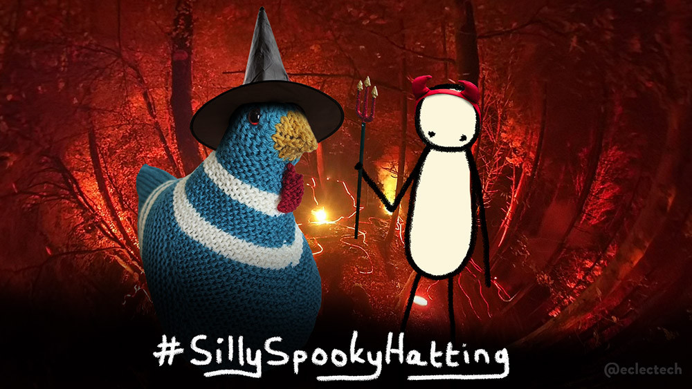A photo of a forest, lit up with orange lights. A large knitted chicken (Myfanwy) in a witches hat sits onthe left, on the right is Friend, a simple scribbled figure wearing red horns and holding a glittery trident. Across the bottom of the image is the scribbled hashtag Silly Spooky Hatting.